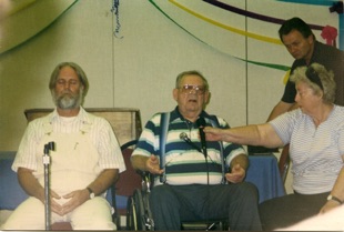 BAKERSFIELD Experiences in the Teaching Mission included the transmissions of Jack Baker, physically disabled but spirit connected. The group welcomed new teachers onto the planet and explored the concept of “reflectivity” in the transmitting process. At left is another transmitter, Al Wolf. At right, his wife Gerry Baker and Calvin McKee of the Salt Lake City TM group. BAKERSFIELD Experiences in the Teaching Mission included the transmissions of Jack Baker, physically disabled but spirit connected. The group welcomed new teachers onto the planet and explored the concept of “reflectivity” in the transmitting process. At left is another transmitter, Al Wolf. At right, his wife Gerry Baker and Calvin McKee of the Salt Lake City TM group.
